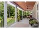 Relaxing covered porch overlooking a lush wooded backyard at 859 Irish Creek Dr, Landis, NC 28088