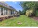 Spacious backyard featuring a wood deck, verdant lawn and privacy landscaping at 191 Melbourne Dr, Fort Mill, SC 29708