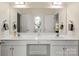 Bright bathroom with double sink vanity, large mirror, and white cabinetry at 191 Melbourne Dr, Fort Mill, SC 29708