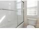 Bathroom featuring a shower with glass door and bright white tile at 191 Melbourne Dr, Fort Mill, SC 29708