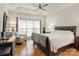 Spacious primary bedroom with wood floors, ceiling fan, and natural light at 191 Melbourne Dr, Fort Mill, SC 29708