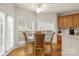 Bright breakfast area with hardwood floors, large windows, and a glass-top table at 191 Melbourne Dr, Fort Mill, SC 29708
