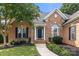 Charming brick home featuring a welcoming front entrance with a well-manicured lawn and garden at 191 Melbourne Dr, Fort Mill, SC 29708