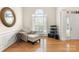 Cozy living room with natural light, wood floors, and comfortable seating area at 191 Melbourne Dr, Fort Mill, SC 29708