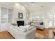 Bright living room with built-in shelving, fireplace, and comfortable seating arrangement at 191 Melbourne Dr, Fort Mill, SC 29708