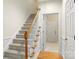 Carpeted staircase with wooden handrail leading to the upper level of the home at 191 Melbourne Dr, Fort Mill, SC 29708