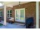 Covered patio with double doors and grill at 1273 10Th Street Pl, Hickory, NC 28601