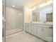 Elegant bathroom with double vanity, marble shower, and modern fixtures at 10513 Boudreaux St, Huntersville, NC 28078