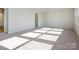 Bright bedroom with carpet flooring and access to bathroom at 10513 Boudreaux St, Huntersville, NC 28078