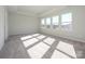 Spacious bedroom with carpet flooring and large windows at 10513 Boudreaux St, Huntersville, NC 28078