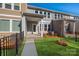 Townhouse with private patio, grassy area, and black fence at 10513 Boudreaux St, Huntersville, NC 28078