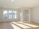 Bright living room with hardwood floors and built-in shelving at 10513 Boudreaux St, Huntersville, NC 28078
