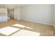 Hardwood floor living room with access to kitchen and stairs at 10513 Boudreaux St, Huntersville, NC 28078