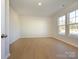 Bright home office with hardwood floors and large windows at 10513 Boudreaux St, Huntersville, NC 28078