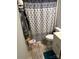 Bathroom with shower and patterned curtain at 735 Ned Marsh Rd, Salisbury, NC 28146