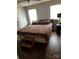 Spacious bedroom with a large bed and dark floors at 735 Ned Marsh Rd, Salisbury, NC 28146