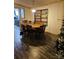 Charming dining area with wood table and chairs, and decorative shelving at 735 Ned Marsh Rd, Salisbury, NC 28146