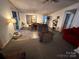 Dining area with a table, chairs, and a recliner at 735 Ned Marsh Rd, Salisbury, NC 28146