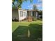 Side view of a mobile home with landscaping at 735 Ned Marsh Rd, Salisbury, NC 28146