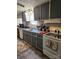 Kitchen with gray cabinets and stainless steel appliances at 735 Ned Marsh Rd, Salisbury, NC 28146