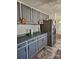 Kitchen with gray cabinets and stainless steel appliances at 735 Ned Marsh Rd, Salisbury, NC 28146