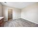 Bright bedroom featuring durable wood-look floors and an adjacent closet or laundry area at 101 Turner Dr, Clover, SC 29710