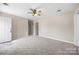 Spacious carpeted bedroom with ceiling fan and easy access to the home's front door at 101 Turner Dr, Clover, SC 29710