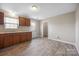 Bright kitchen featuring wood cabinets, laminate countertops, and wood-look vinyl flooring at 101 Turner Dr, Clover, SC 29710