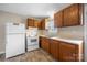 Kitchen with wood cabinets, laminate countertops, and essential appliances including a white refrigerator at 101 Turner Dr, Clover, SC 29710