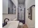 Modern bathroom with gray tile, black fixtures, and a glass shower at 818 N Jackson St, Salisbury, NC 28144