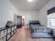 Bedroom with ensuite bathroom and light wood floors at 818 N Jackson St, Salisbury, NC 28144