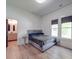 Bedroom with ensuite bathroom and light wood floors at 818 N Jackson St, Salisbury, NC 28144