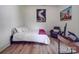 Bright bedroom with a comfortable bed, workspace, and two large pieces of art at 818 N Jackson St, Salisbury, NC 28144