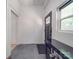 Simple entryway with black door and grey tile floor at 818 N Jackson St, Salisbury, NC 28144