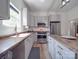 Modern kitchen with gray cabinets, wood countertops, and stainless steel appliances at 818 N Jackson St, Salisbury, NC 28144