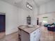 Modern kitchen with gray cabinets, wood countertops, and stainless steel appliances at 818 N Jackson St, Salisbury, NC 28144