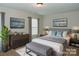 Well-decorated bedroom with neutral walls, wood furniture and decorative wall art at 1327 Phil Oneil Dr, Charlotte, NC 28215