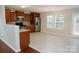 Well-equipped kitchen featuring stainless steel appliances, wood cabinets, and a breakfast area with lots of natural light at 1327 Phil Oneil Dr, Charlotte, NC 28215