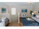 Living room with modern decor, stylish furniture, and tasteful wall art at 1327 Phil Oneil Dr, Charlotte, NC 28215