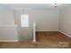 Upstairs loft with carpeted floors and good natural lighting at 1327 Phil Oneil Dr, Charlotte, NC 28215