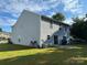 View of the backyard, showcasing the vinyl siding and patio at 2548 Sweet Birch Ct, Gastonia, NC 28054