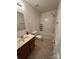 Well-lit bathroom featuring a tub and shower combo with a functional vanity at 2548 Sweet Birch Ct, Gastonia, NC 28054