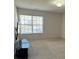 Bright bedroom featuring neutral walls, carpet, and large windows offering ample natural light at 2548 Sweet Birch Ct, Gastonia, NC 28054