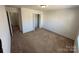 Bedroom featuring neutral walls, carpet, and access to the closet and doorways at 2548 Sweet Birch Ct, Gastonia, NC 28054