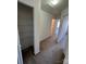 Walk in closet to bedroom with carpeted floors and metal shelving at 2548 Sweet Birch Ct, Gastonia, NC 28054