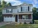 Charming two-story home with a covered porch and well-maintained lawn at 2548 Sweet Birch Ct, Gastonia, NC 28054