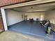 Spacious garage with epoxy flooring, offering ample storage and parking space at 2548 Sweet Birch Ct, Gastonia, NC 28054