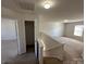 Carpeted upstairs hallway leads to a bright, open-concept room with a window at 2548 Sweet Birch Ct, Gastonia, NC 28054