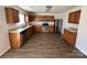 Open kitchen area with stainless steel appliances and wood cabinets at 2548 Sweet Birch Ct, Gastonia, NC 28054