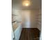 Bright laundry room with washer, dryer, and shelving units at 2548 Sweet Birch Ct, Gastonia, NC 28054
